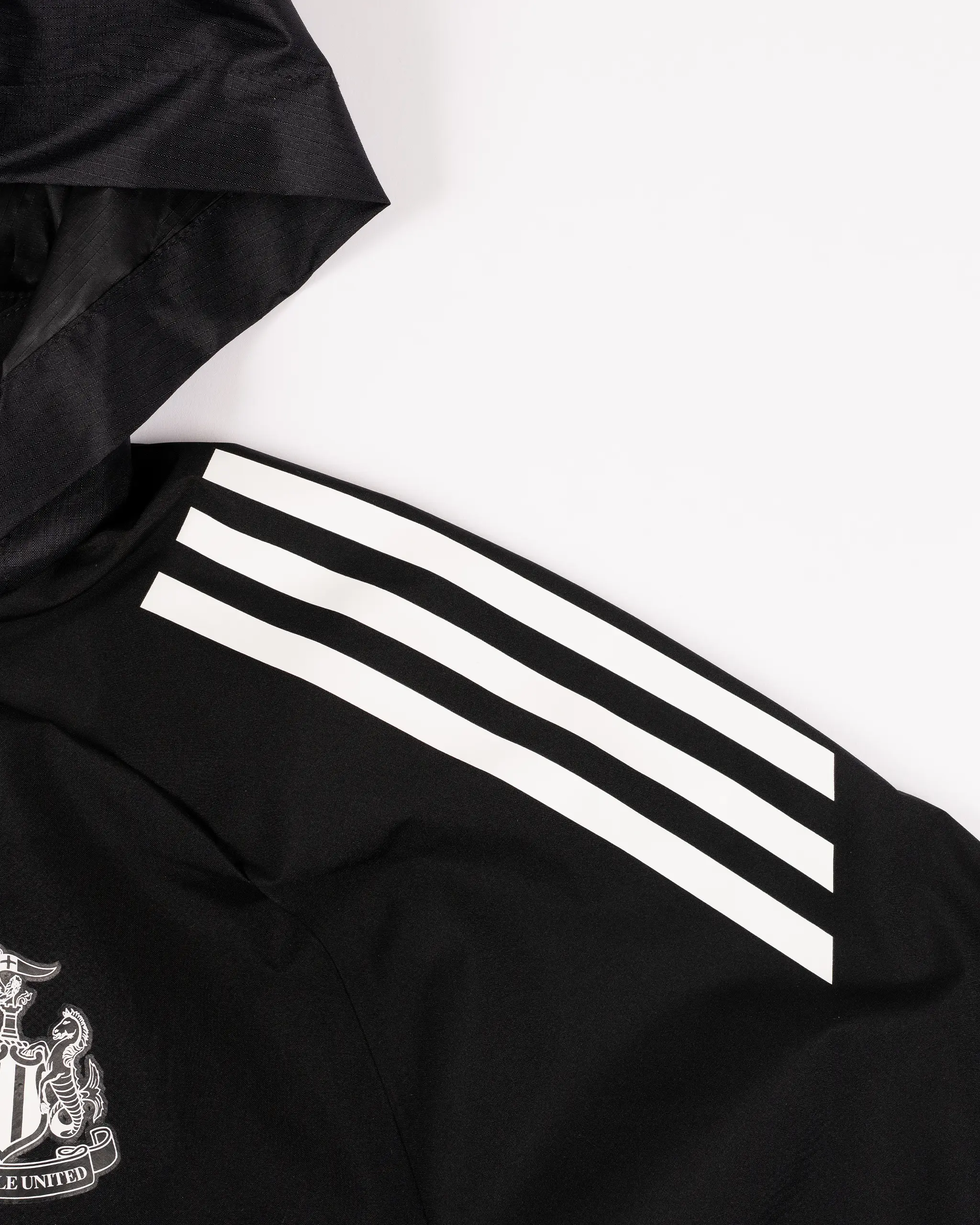 Newcastle United adidas 25/26 Coach's Black Edition Kids' All Weather Jacket - Image 3