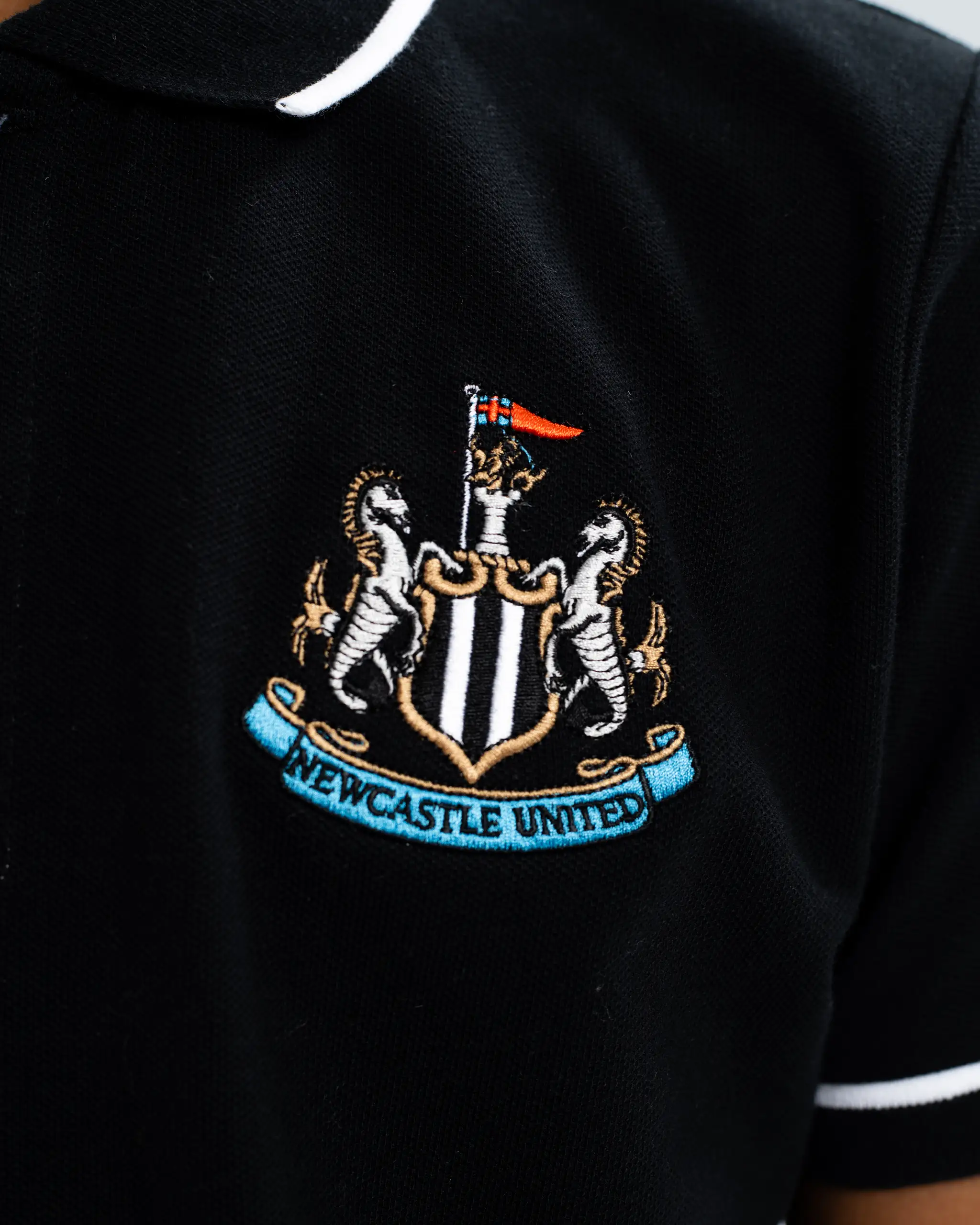 Newcastle United Kids' Essentials Range Black Polo Shirt - Image 3